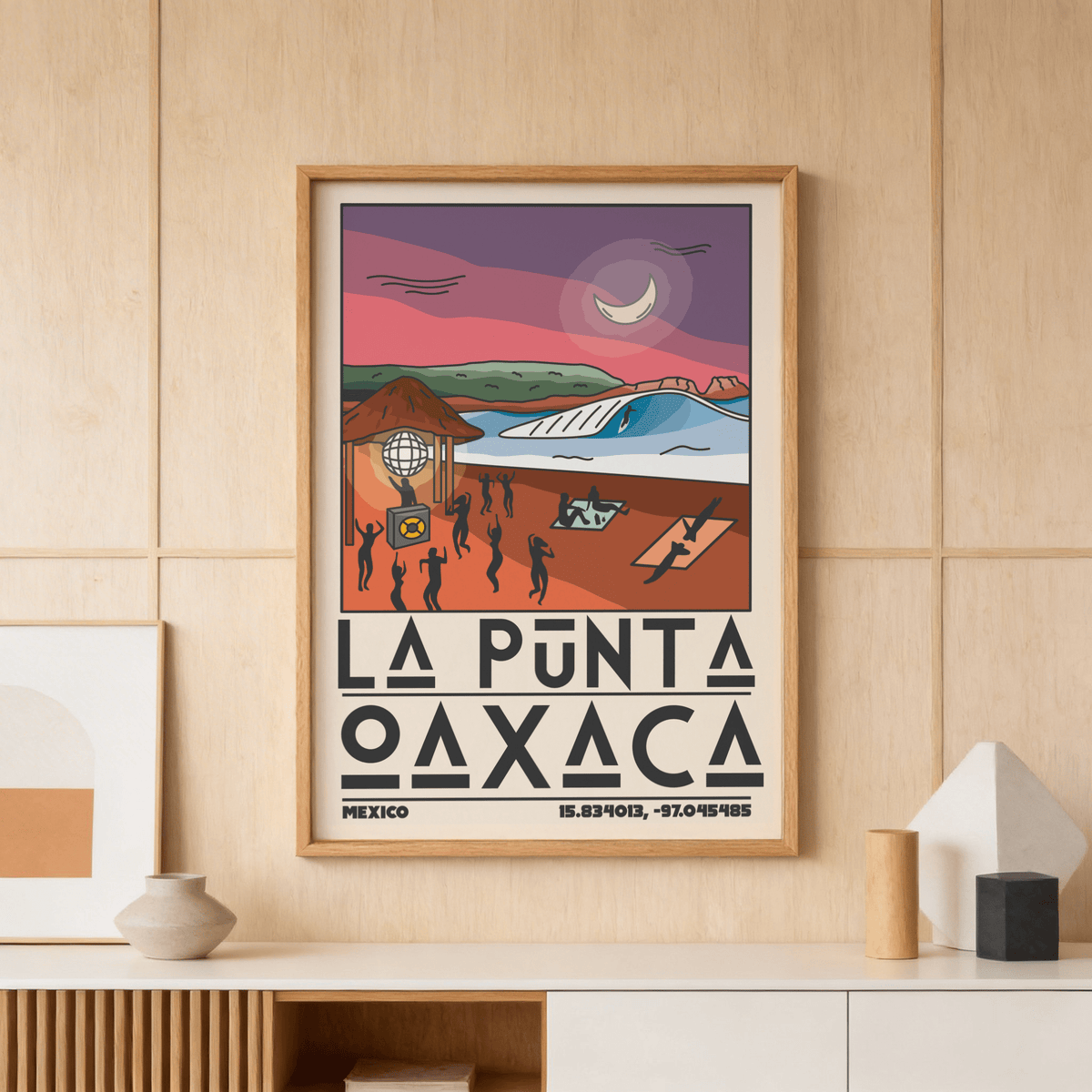La Punta Oaxaca wall art of a sunset beach scene in purple and orange above a sideboard with ceramics