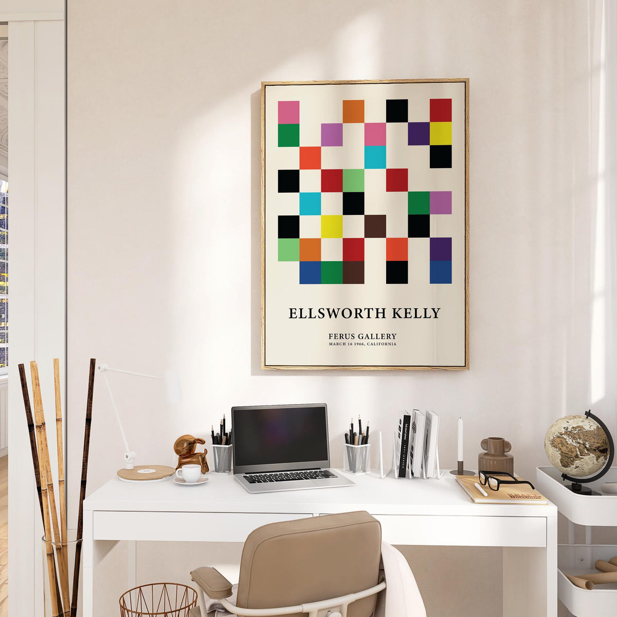 Posters for Office showing a colourful squares grid with text below above a white desk with laptop and globe