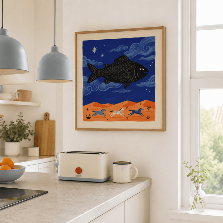 Whimsical Fish Art Print of a flying black fish with horses in a desert scene in a bright kitchen