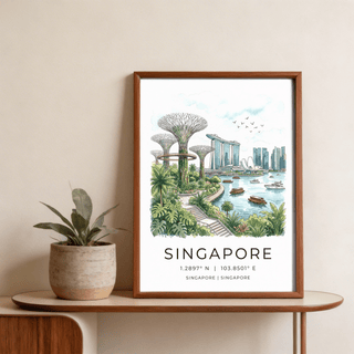 Framed Singapore City Landscape Art of Marina Bay Sands and Supertree Grove on a wooden table beside a plant pot