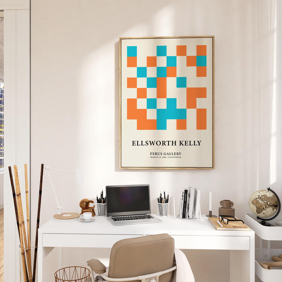 Framed print of Large Geometric Wall Art with blue and orange squares above a desk with a laptop