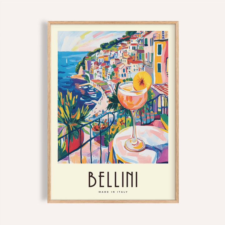 Framed print close-up of Italian style cocktail wall art with colourful coastal village and Bellini cocktail