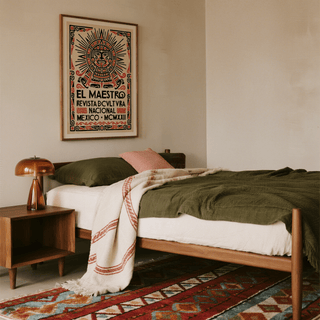 Mexican Culture Poster in a bedroom with an olive-green bedspread and a brown bedside lamp