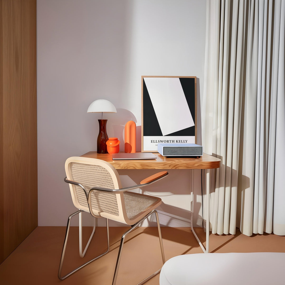 Black and White Office Print leaning on a wooden desk with a chair and lamp nearby