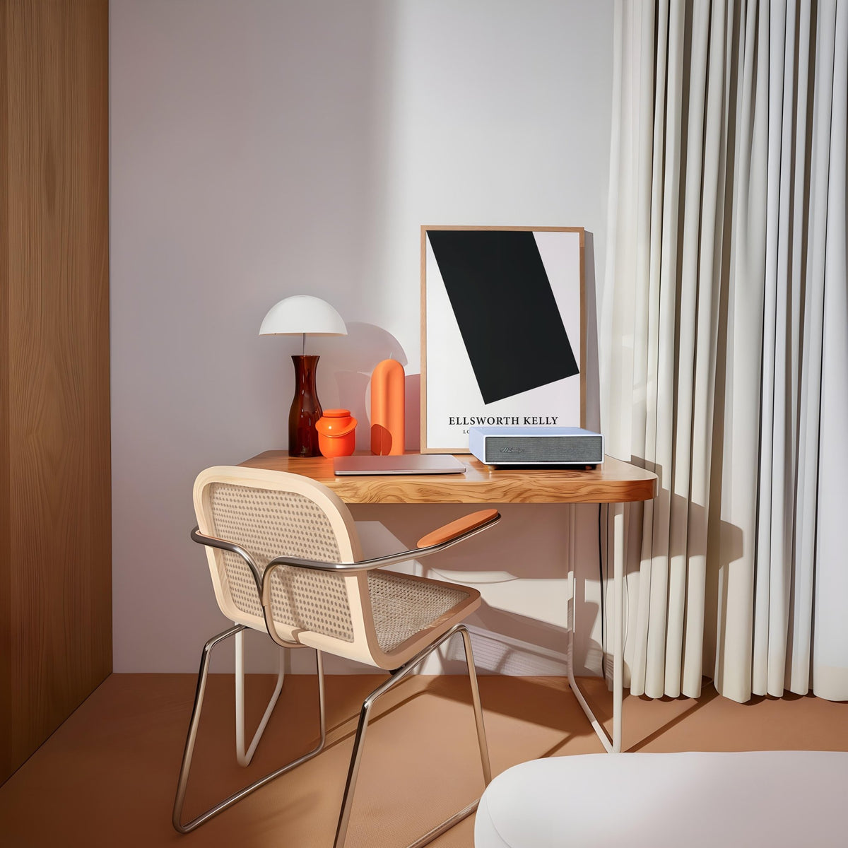 Black and White Office Wall Art with a large black rectangle on white leaning on a desk beside a lamp