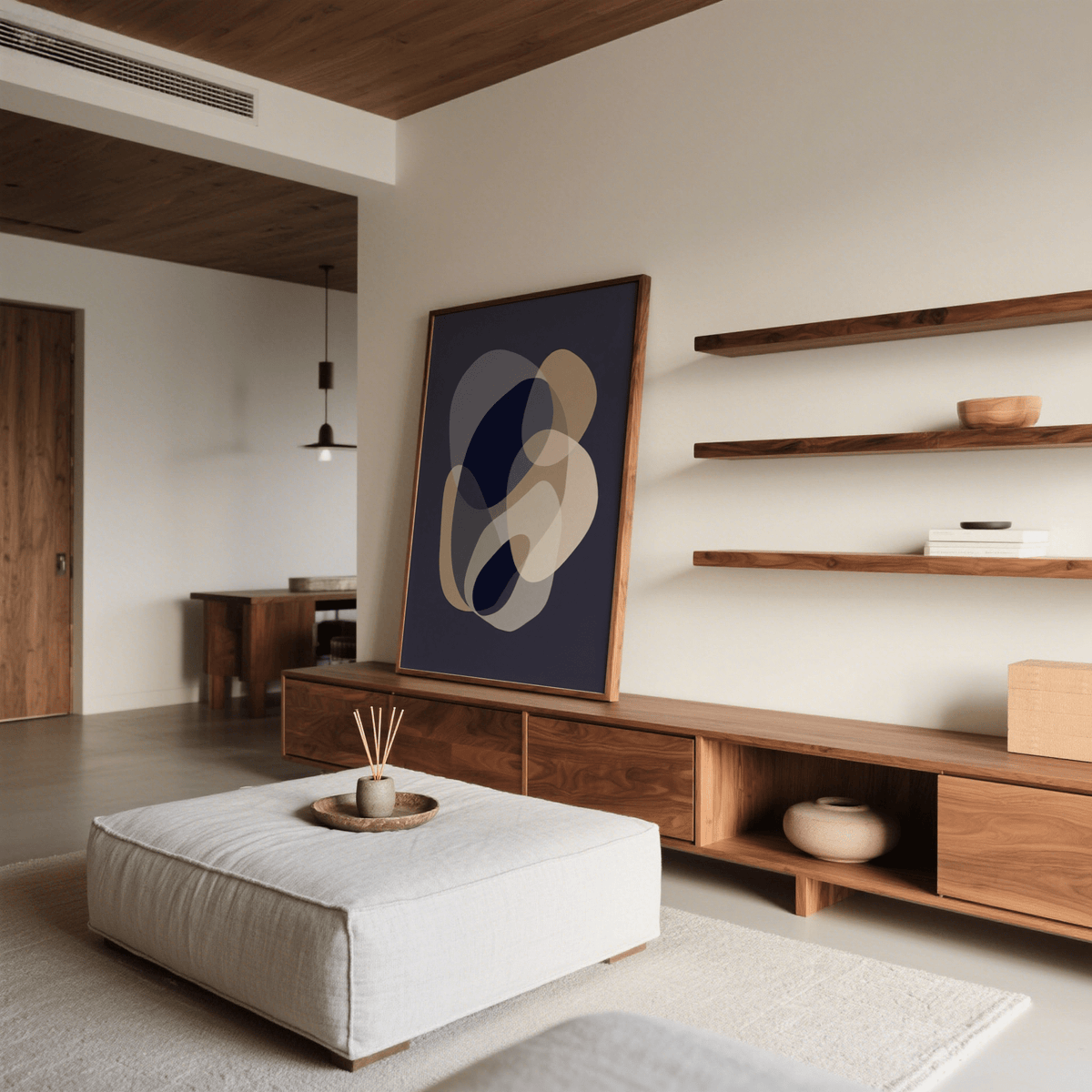 Print on a wooden stand of Prints Abstract Art with blue and beige organic shapes in a living room with shelves