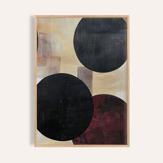Bold black circles in abstract neutral art with beige and burgundy tones in a wooden frame