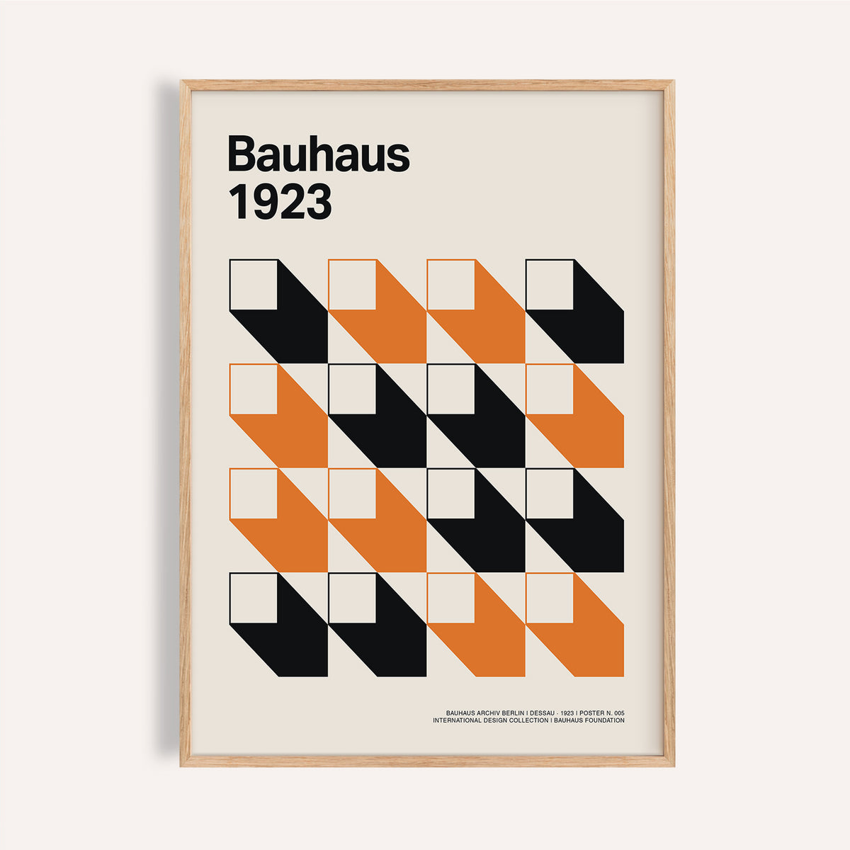 Framed close-up of Bauhaus Gallery Wall Art with black and orange geometric shapes on a cream background