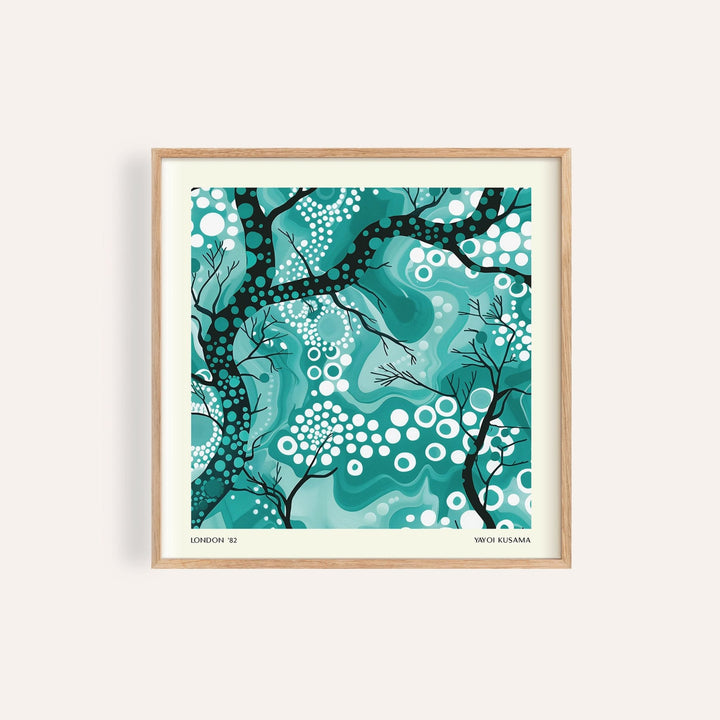 Teal abstract wall art with black tree branches and white dots in a wooden frame