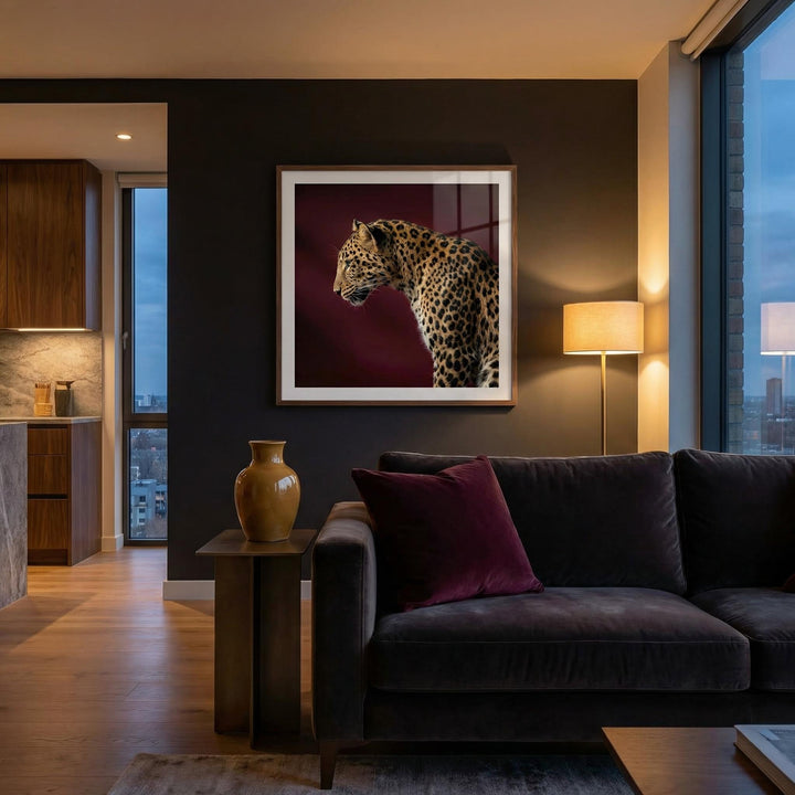 Leopard Art Print in a living room showing a side profile of a spotted leopard against a dark red background with a lamp nearby