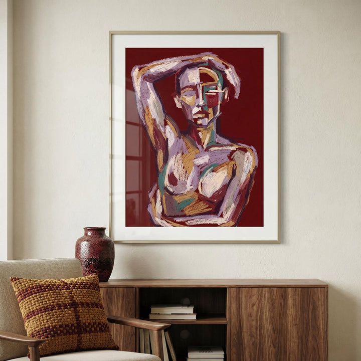 Contemporary Figure Art framed print of an abstract human figure in reds and browns above a wooden sideboard with a vase