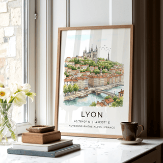 Lyon City Art Print leaning on a windowsill with books and a cup nearby in soft daylight