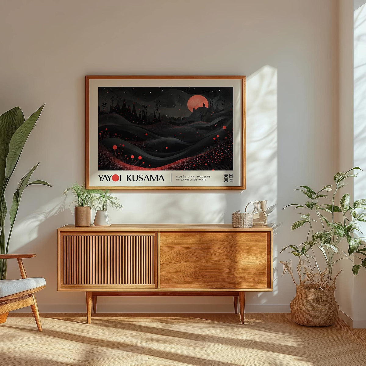 Moon print framed on a wall above a wooden cabinet with plants and sunlight
