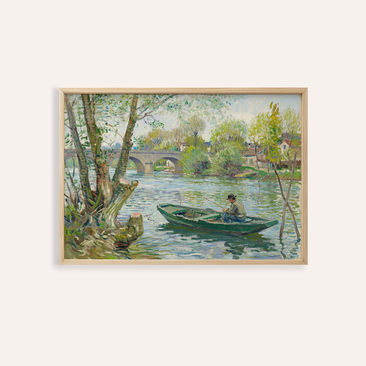 Framed print close-up of a man fishing in a green boat on a river with trees and a stone bridge