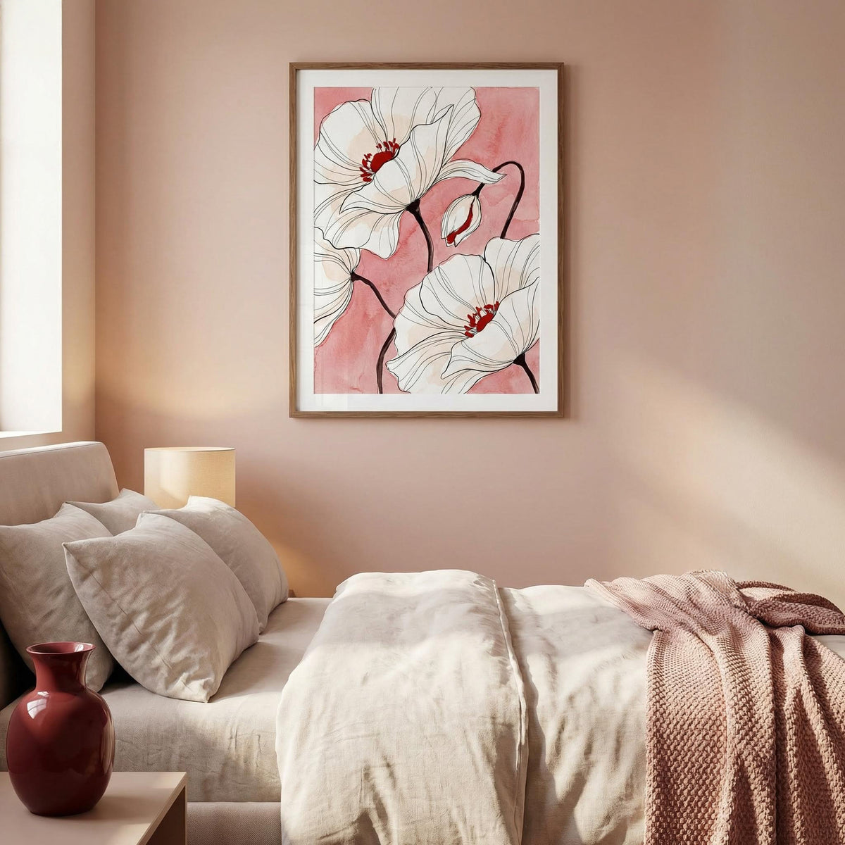Botanical Floral Art Print hanging above a bed with white poppy flowers on a pink background