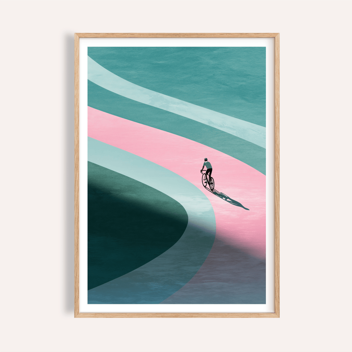 Framed print close-up of minimalist cycling art print with a cyclist on a curved pink and blue path