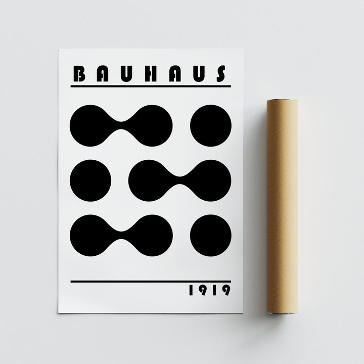 Minimalist Geometric Print with black Bauhaus circles and shapes beside a brown packaging tube
