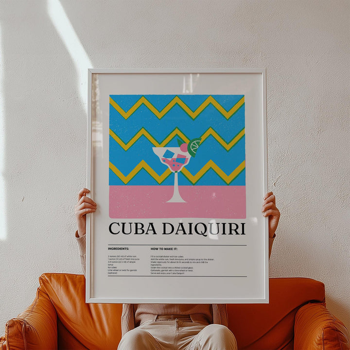 Alcohol artwork with a minimalist daiquiri glass and bold blue and yellow zigzag background held on a brown leather sofa