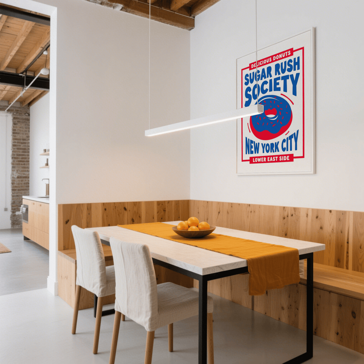 Donut wall art in blue and red colours above dining table with wooden panel and fruit bowl