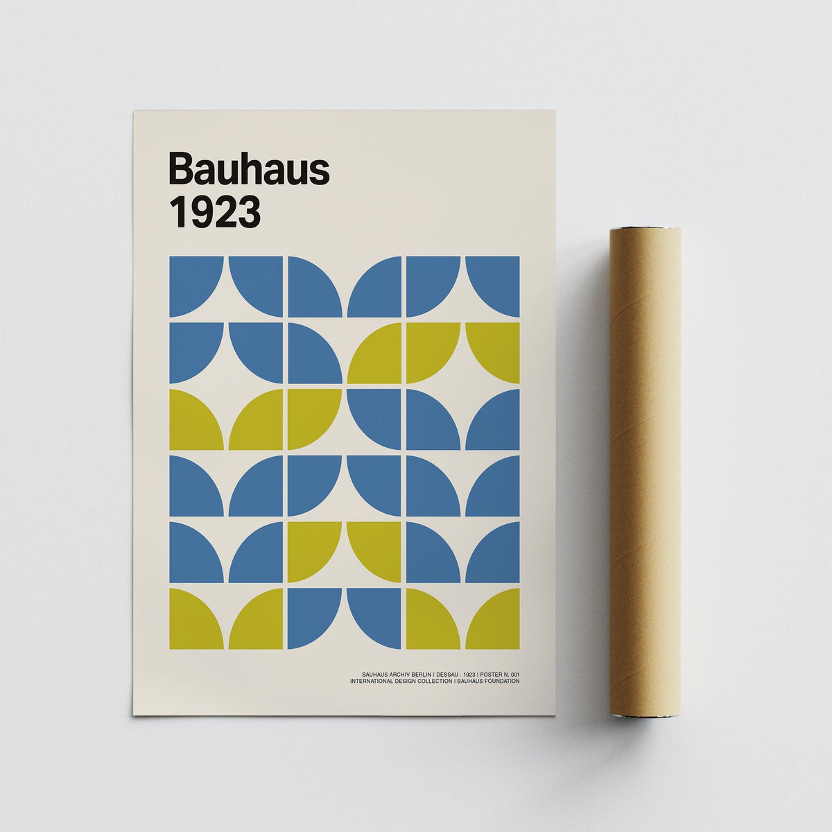 Modern Office Wall Decor Bauhaus geometric pattern with blue and green shapes beside a packaging tube
