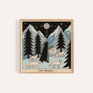 Framed print of The Hermit Tarot Card Art showing a hermit with a lantern and foxes against a mountain backdrop