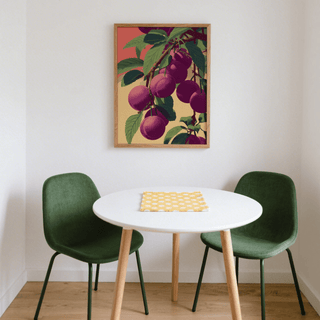 Plum Poster on wall above white round table with green chairs and yellow cloth