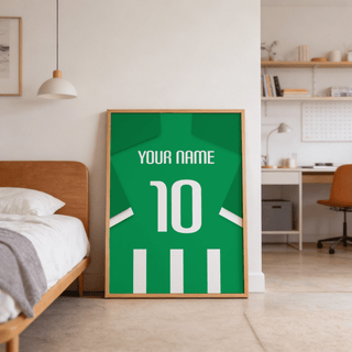 Football Shirt Poster in Green and White Stripes leaning on the floor by a wooden bed in a bedroom