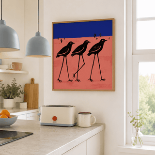Desert Bird wall art of minimalist black birds with a blue and pink background in a bright kitchen