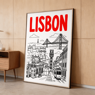 Framed Lisbon Travel Art print with red text and black line-art leaning on wood floor by a cabinet