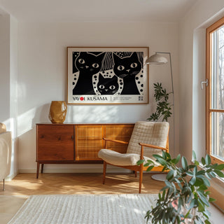 Black Cat wall art with three black cats in minimalist style above a wooden sideboard in a bright living room