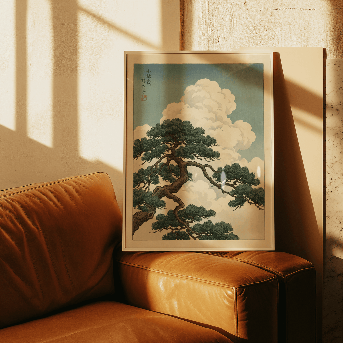 Japanese Landscape Poster print leaning on a leather chair with sunlight and shadows