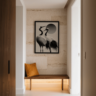 Black And White Crane Print on a textured beige wall above a wooden bench with an orange cushion