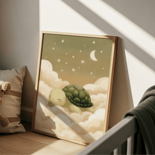 Print leaning on a floor showing turtle wall art of a sleeping turtle with green and cream tones near a brown cushion