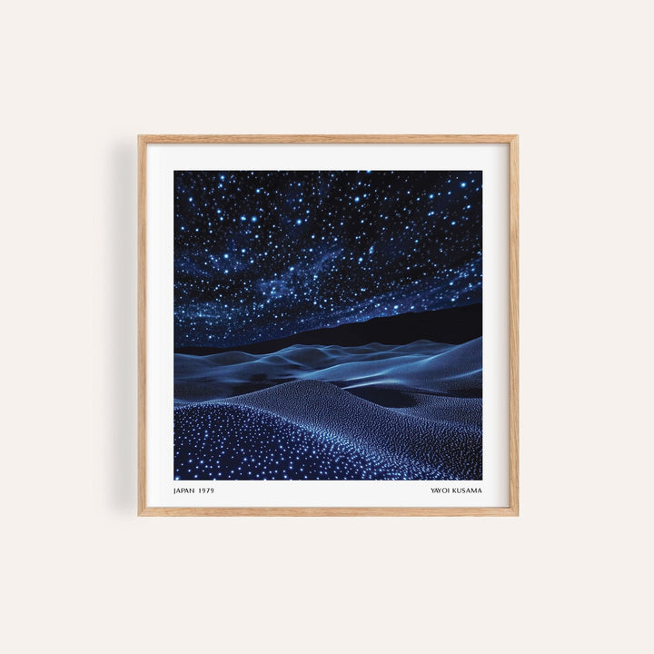 Framed navy blue artwork of a starry night sky and rolling hills with white dots