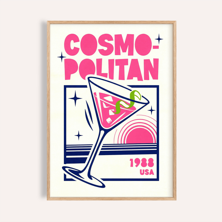 Framed Cosmopolitan Cocktail Art Print with bold pink and navy design in a wooden frame