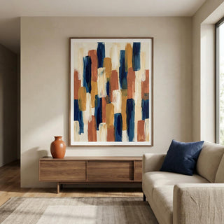 Abstract Color Blocks print on a wall in a lounge with a wooden sideboard and terracotta vase