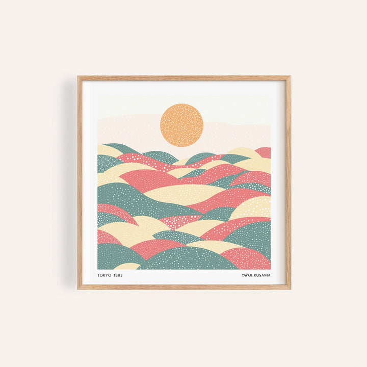 Framed Pastel Abstract Artwork of abstract hills in soft pink green and yellow with a dotted sun