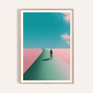 Framed Surreal Cycling Art Print of man cycling on a green path with pink landscape and blue sky