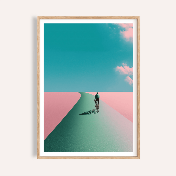 Framed Surreal Cycling Art Print of man cycling on a green path with pink landscape and blue sky