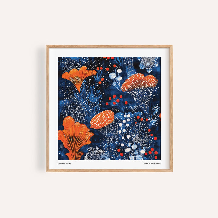 Framed close-up of blue orange wall art with abstract botanical illustration in orange and white