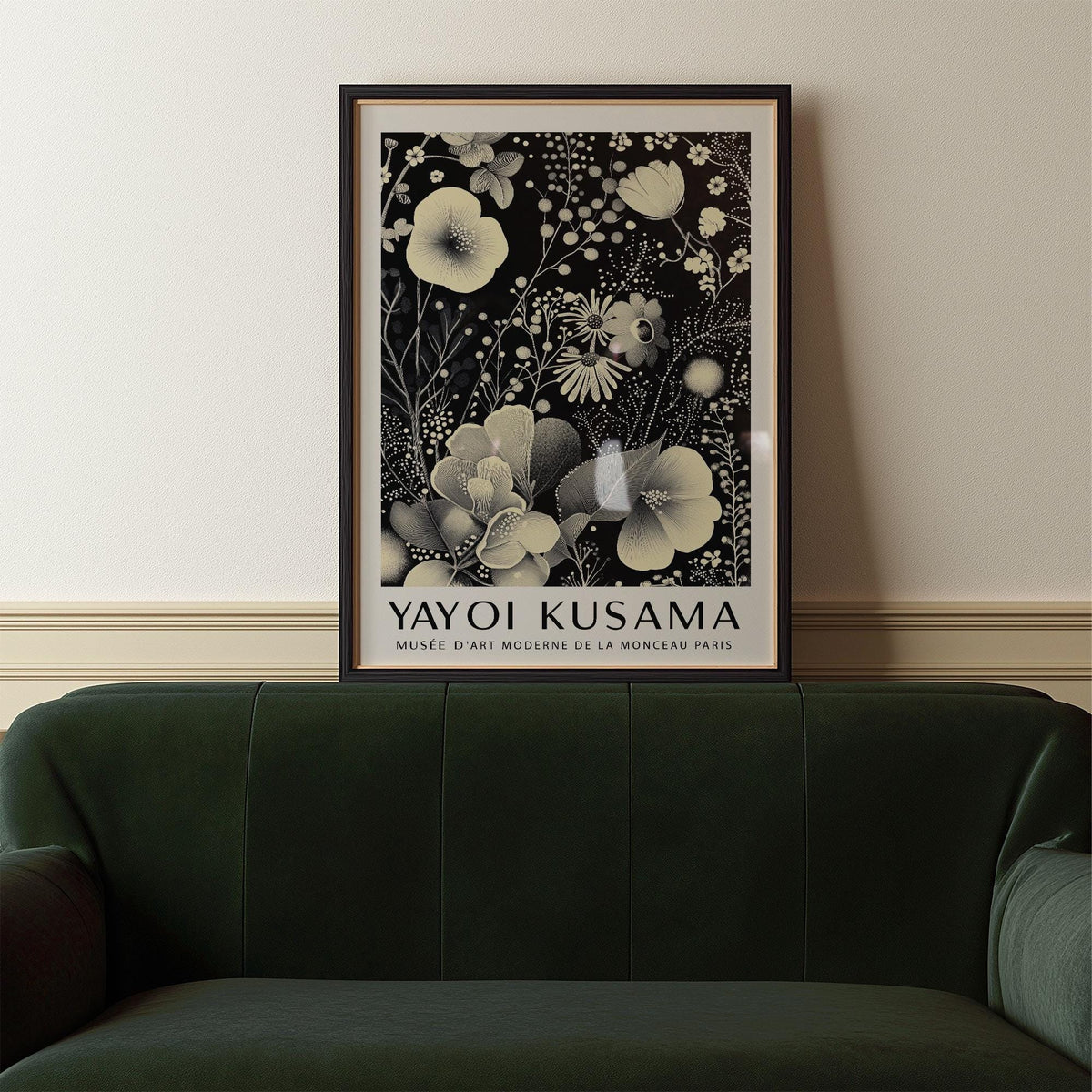 Large Floral Wall Art with ivory floral pattern in black frame above a green sofa