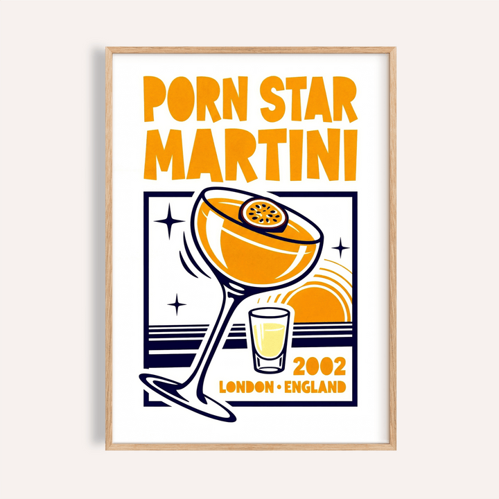 Framed close-up of Passion Fruit Martini Print with orange and navy illustration on a white background
