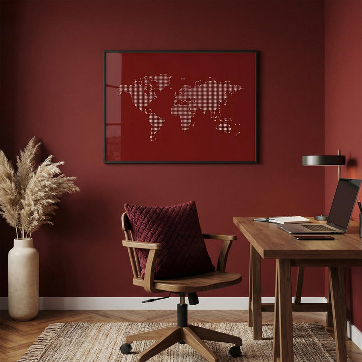 World Map Wall Poster framed print close-up of a dotted minimalist map in red and beige with a brown chair and cushion