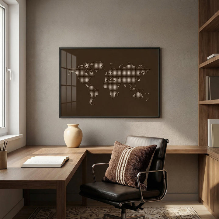 World Map Poster print on a wall showing beige dots on a brown background above a wooden desk with a vase
