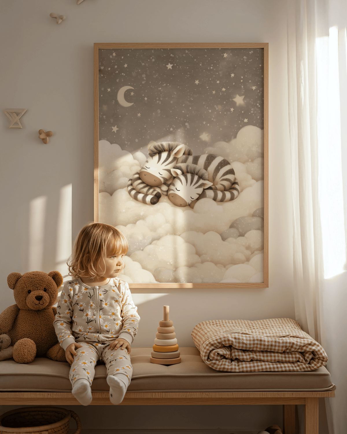 Zebra nursery art framed print of two sleeping baby zebras on clouds in a child's room next to a teddy bear