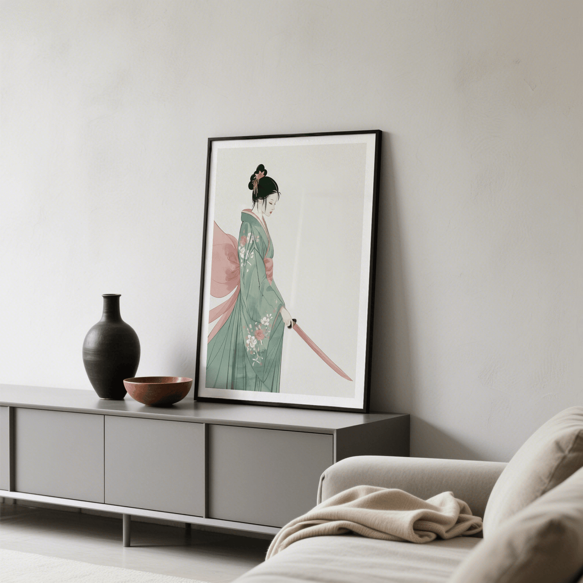 Print leaning on a shelf of samurai woman in green and pink traditional attire beside a black vase