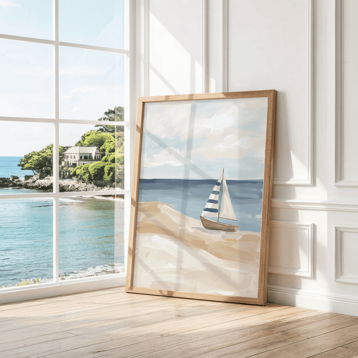 Print leaning on wooden floor of a striped sailboat in soft blues and beige by a white wall