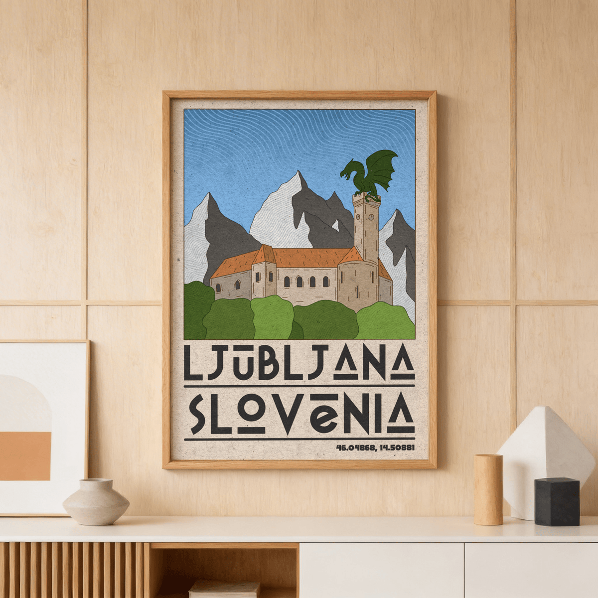 Framed Ljubljana Slovenia art print of dragon statue on castle tower with mountains and greenery above a shelf