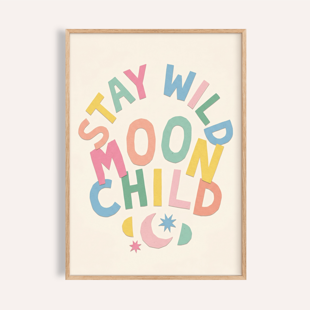 Close-up of Moon Child wall art with colourful typography and moon and stars in a wooden frame