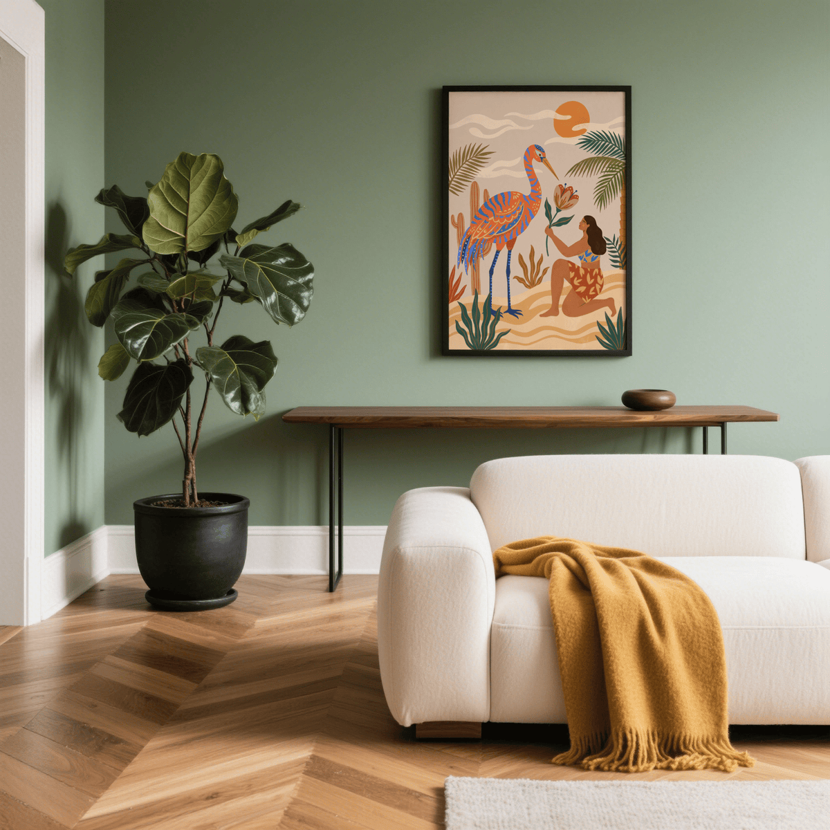 Tropical Bird Artwork print on a green wall above a wooden console with a plant nearby in a lounge